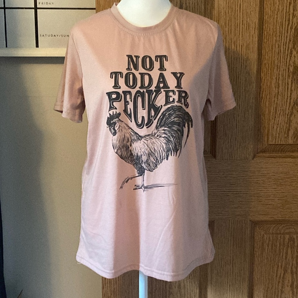 Boutique “pecker” tee.